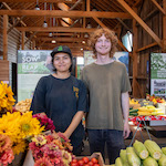students running the farmstand